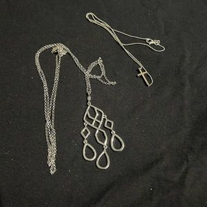Two silver necklaces.